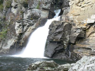 Bottom Of Linville Main Falls
Note the small squirt of water eroding the huge rock to the right of the falls.
