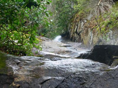 From The top
This view of Coon Den if grom the bottom looking straight up.

Coon Den is near Hampton, TN. Just ask any local for Dennis Cove, go over the mountain, pass the Appalachian Trail and keep looking on your right for the trail going up. It is well marked and just about a half mile.
